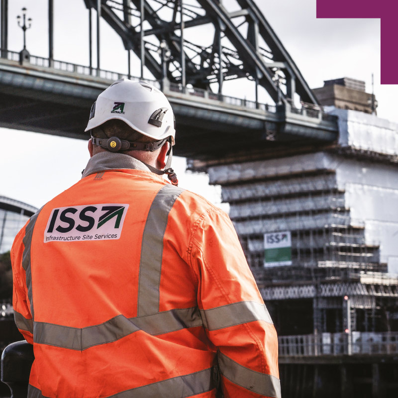 ISS employee looking at the Tnbe Bridge which is partially covered by scaffolding.